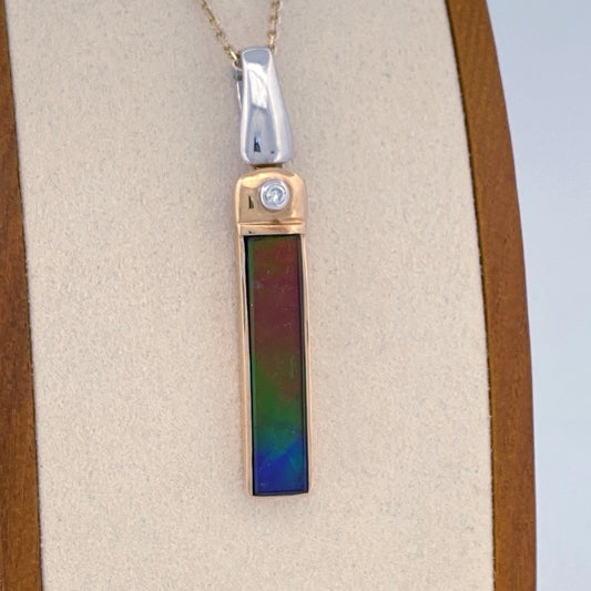 Unveiling a Gemstone Wonder: 18k Two-Tone Ammolite & Diamond Pendant (On Consignment)